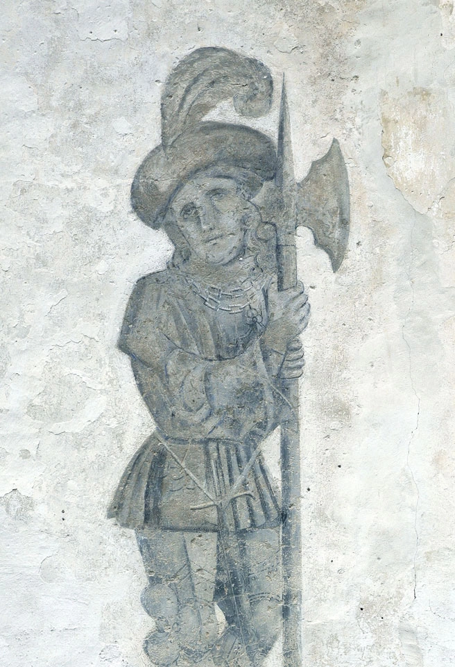 Affresco raffigurante un lanzichenecco armato di alabarda nel castello